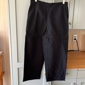 Royal Robbins black nylon cropped pants/zip off shorts. 
Size 10, side pockets.